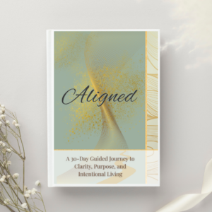 Book cover that reads Aligned: A 30-Day Journey to Clarity, Purpose, and Intentional Living
